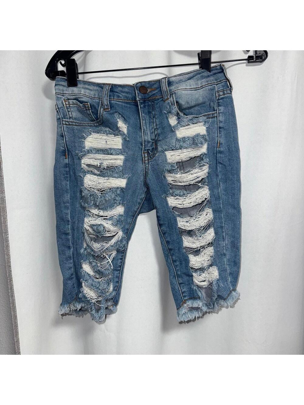 Aphrodite distressed denim Bermuda shorts with a frayed hem